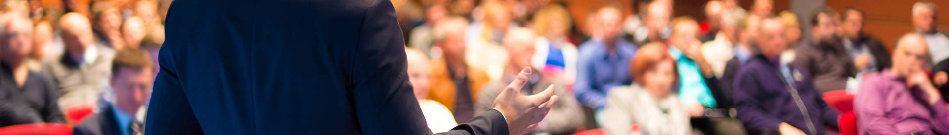 man speaking at conference